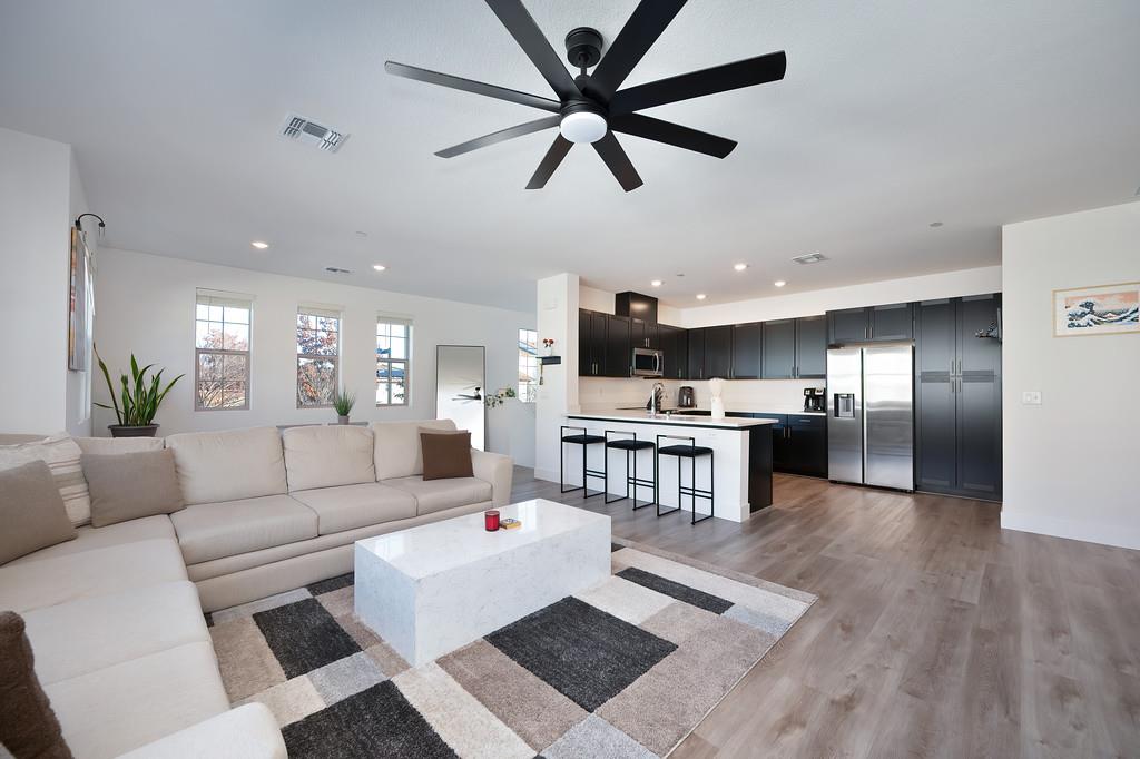 5301 East Commerce Way, Unit 32101 Sacramento, CA 95835 - Photo 17 of 41 a living room with furniture and kitchen view