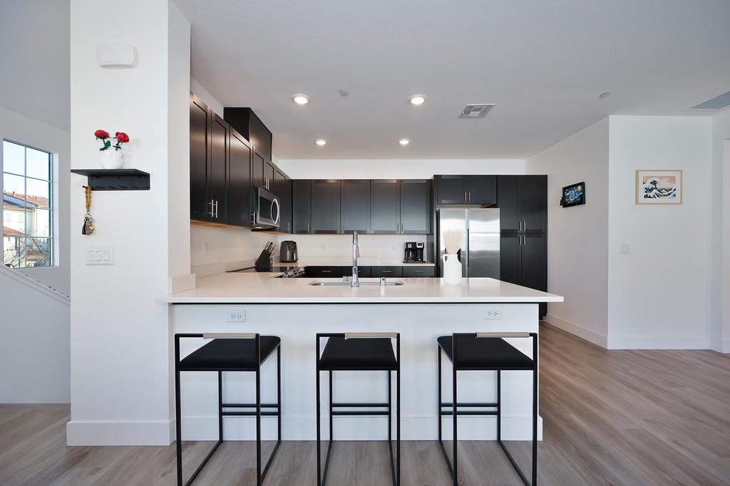 5301 East Commerce Way, Unit 32101 Sacramento, CA 95835 - Photo 19 of 41 a kitchen with a table and chairs in it