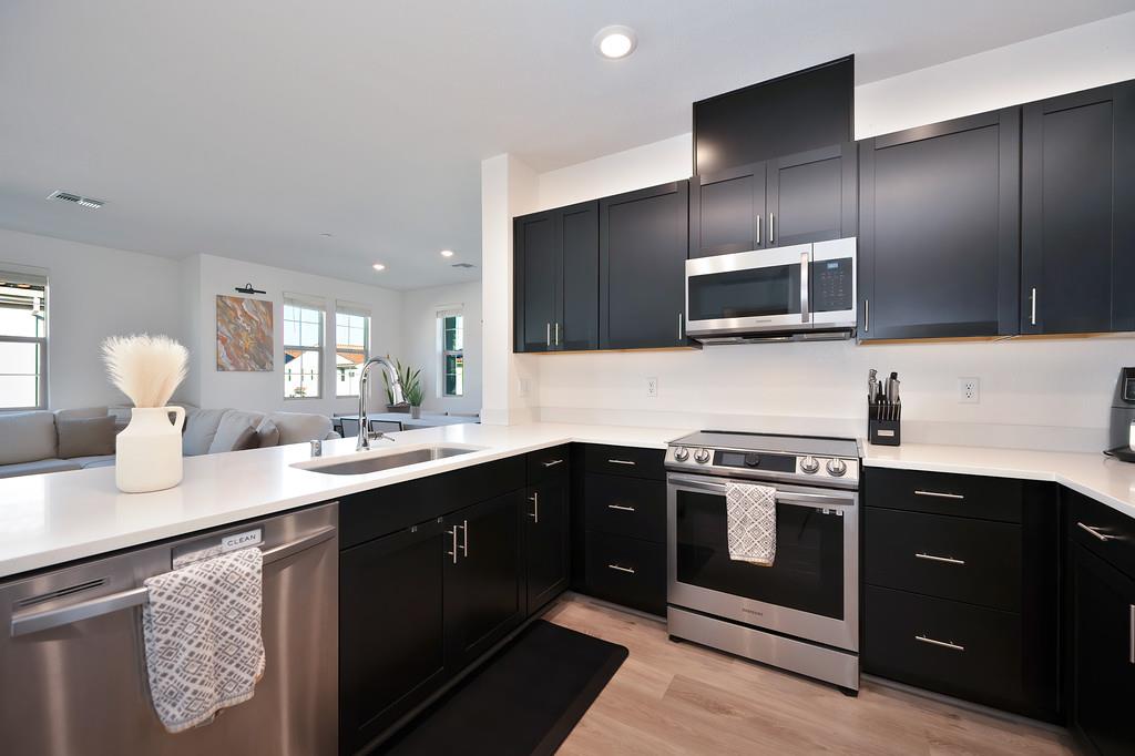 5301 East Commerce Way, Unit 32101 Sacramento, CA 95835 - Photo 24 of 41 a kitchen with a sink stove and microwave