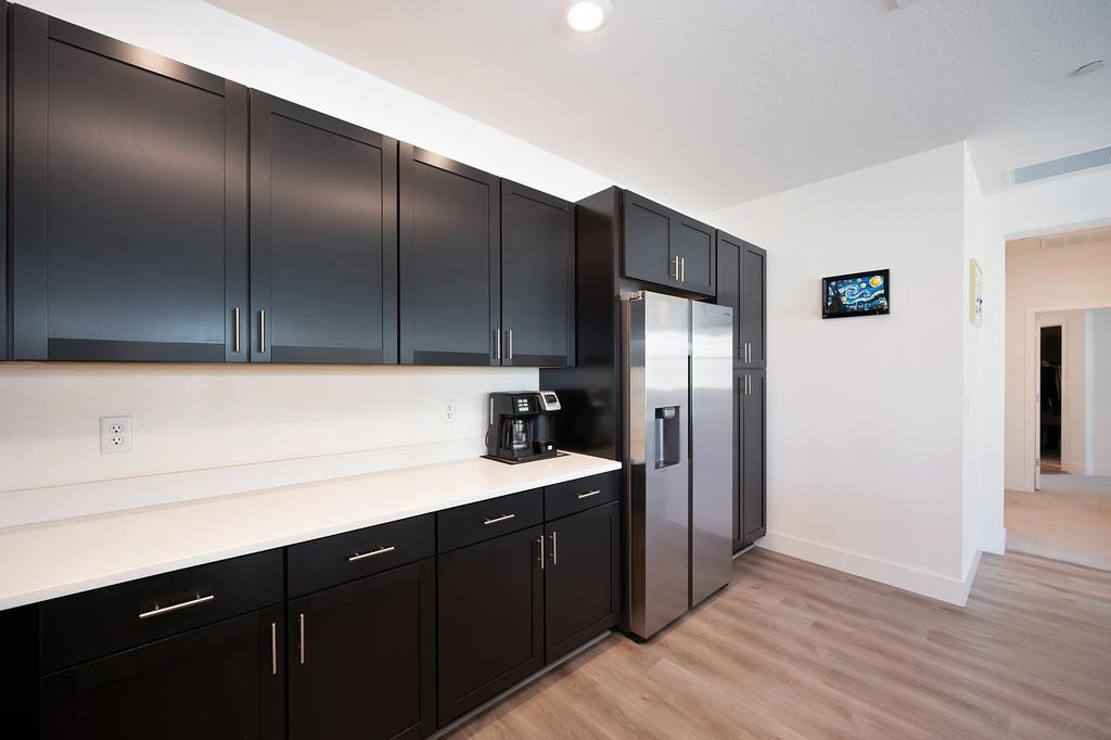 5301 East Commerce Way, Unit 32101 Sacramento, CA 95835 - Photo 26 of 41 a kitchen with a sink refrigerator and cabinets