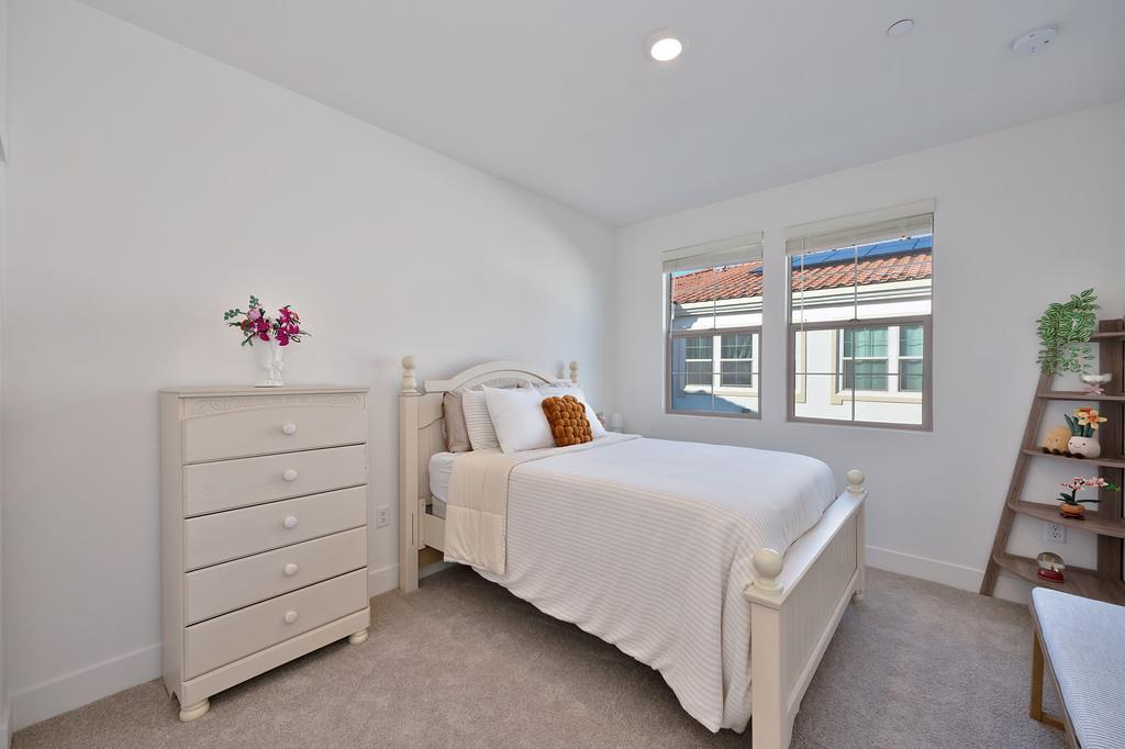 5301 East Commerce Way, Unit 32101 Sacramento, CA 95835 - Photo 28 of 41 a bedroom with a bed and a dresser