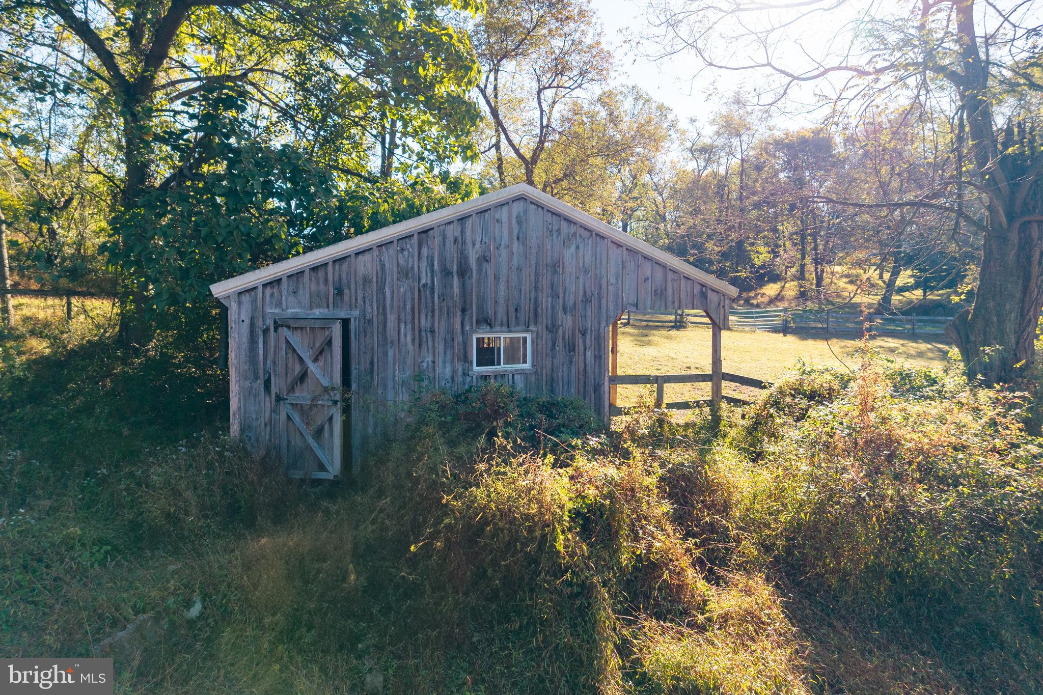 2275 Strasburg Road Coatesville, PA 19320 - Photo 13 of 29 a backyard of a house with lots of green space