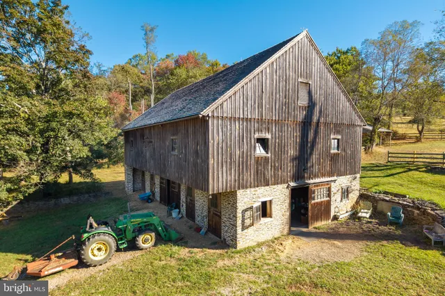 a view of a wooden house with a yard