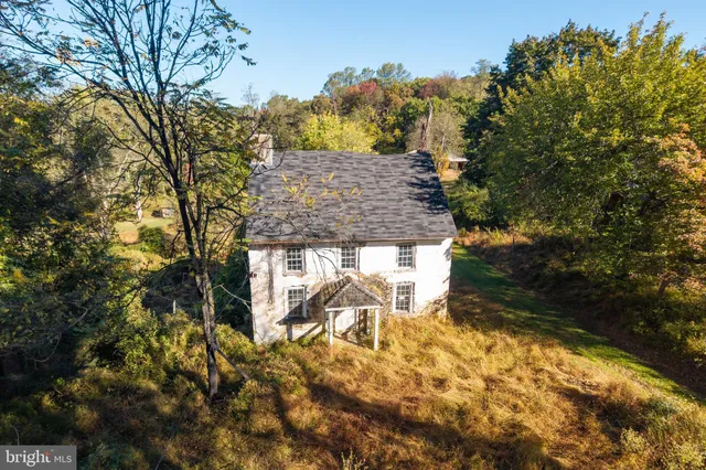 a view of house with outdoor seating