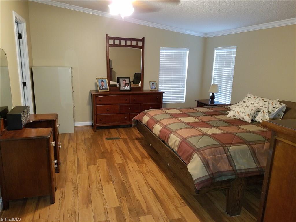 344 Prison Camp Road Dobson, NC 27017 - Photo 21 of 28 LARGE MASTER BEDROOM WITH WOOD FLOORS