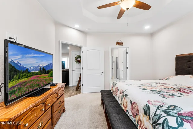 a spacious bathroom with a sink a shower and a mirror