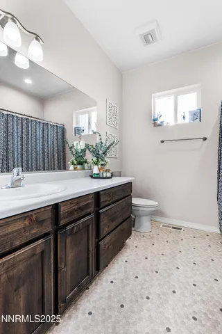 a bedroom with a bed and cabinets