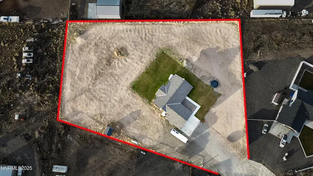 a view of a house with a big yard and large trees