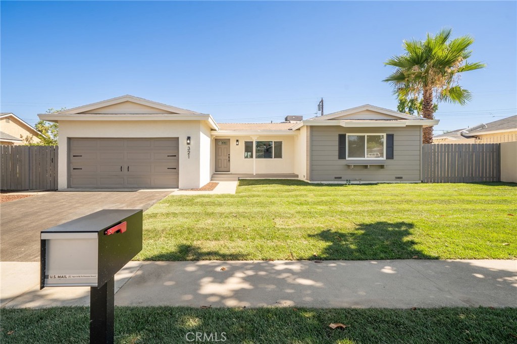 a front view of a house with yard