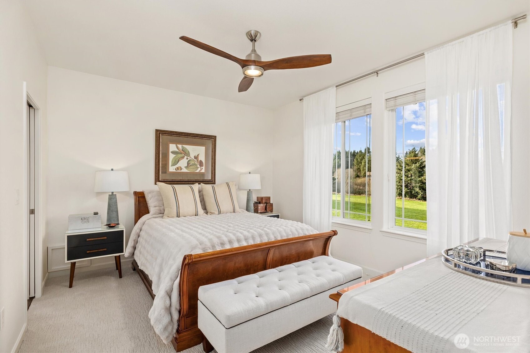 4946 Pleasant Glade Road Northeast Olympia, WA 98516 - Photo 16 of 38 a bedroom with a bed and a table