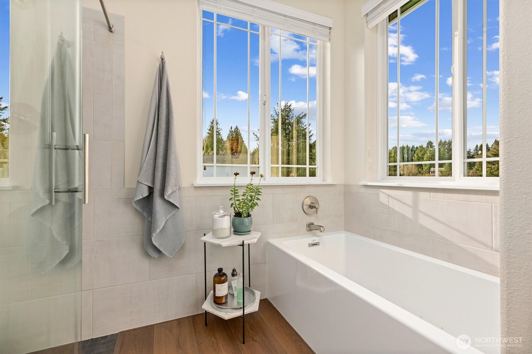 4946 Pleasant Glade Road Northeast Olympia, WA 98516 - Photo 19 of 38 a bathroom with a bathtub and a shower