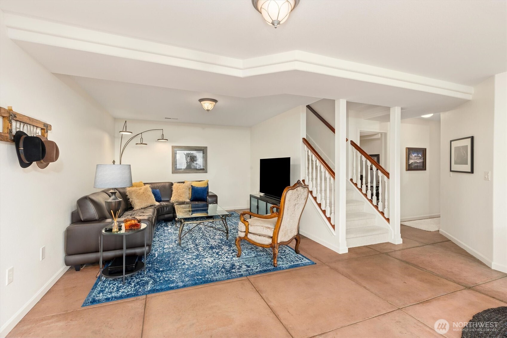 4946 Pleasant Glade Road Northeast Olympia, WA 98516 - Photo 20 of 38 a living room with furniture and stairs