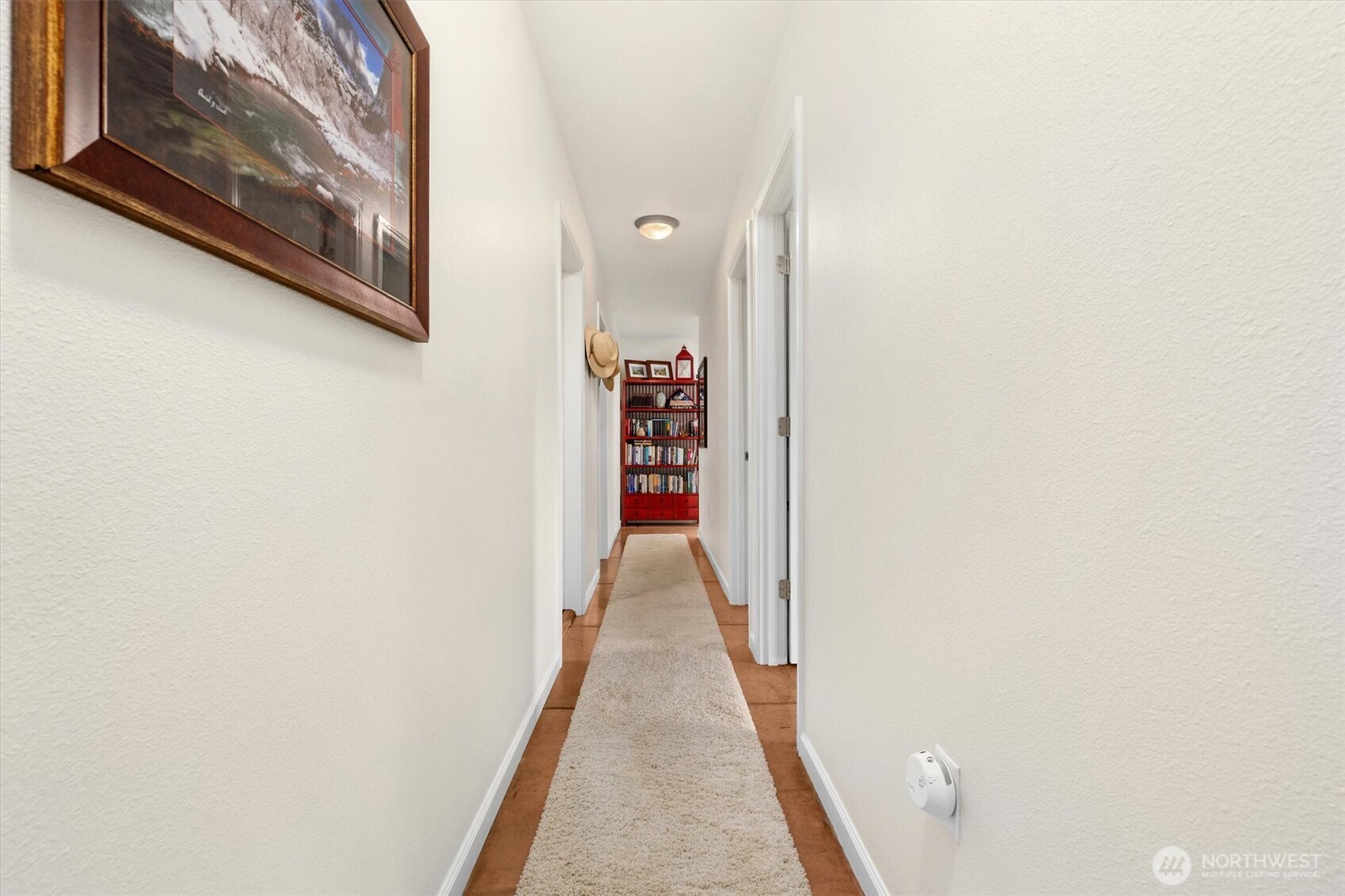 4946 Pleasant Glade Road Northeast Olympia, WA 98516 - Photo 22 of 38 a view of a hallway with wooden floor and entryway