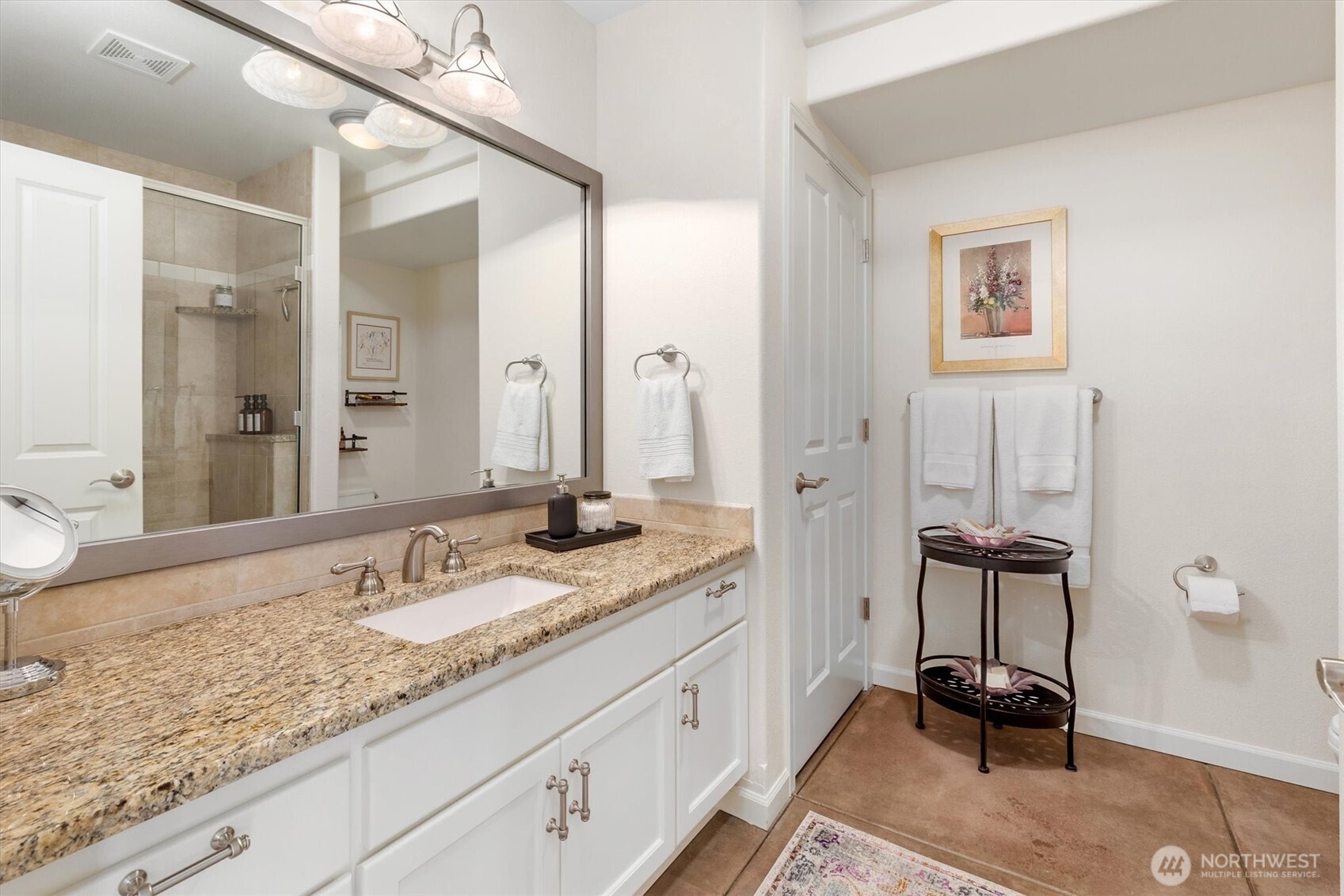 4946 Pleasant Glade Road Northeast Olympia, WA 98516 - Photo 25 of 38 a bathroom with a sink and a mirror