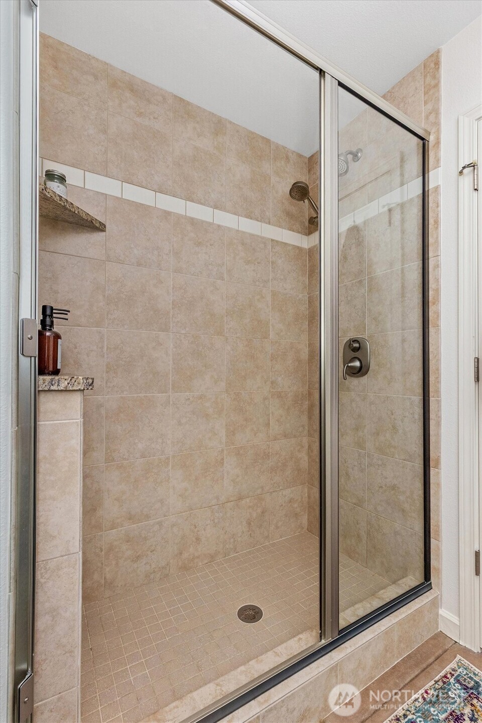 4946 Pleasant Glade Road Northeast Olympia, WA 98516 - Photo 26 of 38 a bathroom with a glass shower door