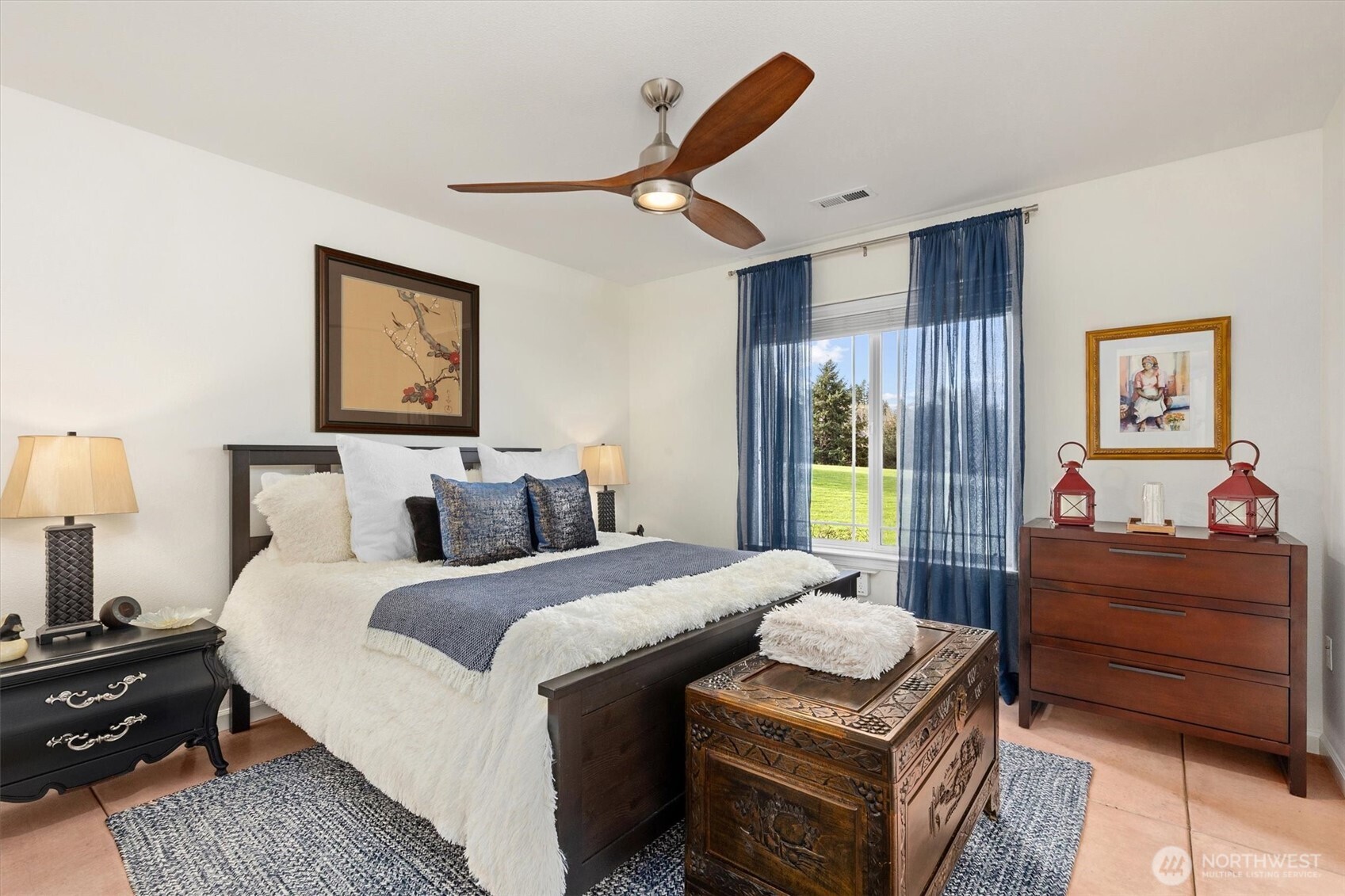 4946 Pleasant Glade Road Northeast Olympia, WA 98516 - Photo 27 of 38 a bedroom with a bed and wooden floor