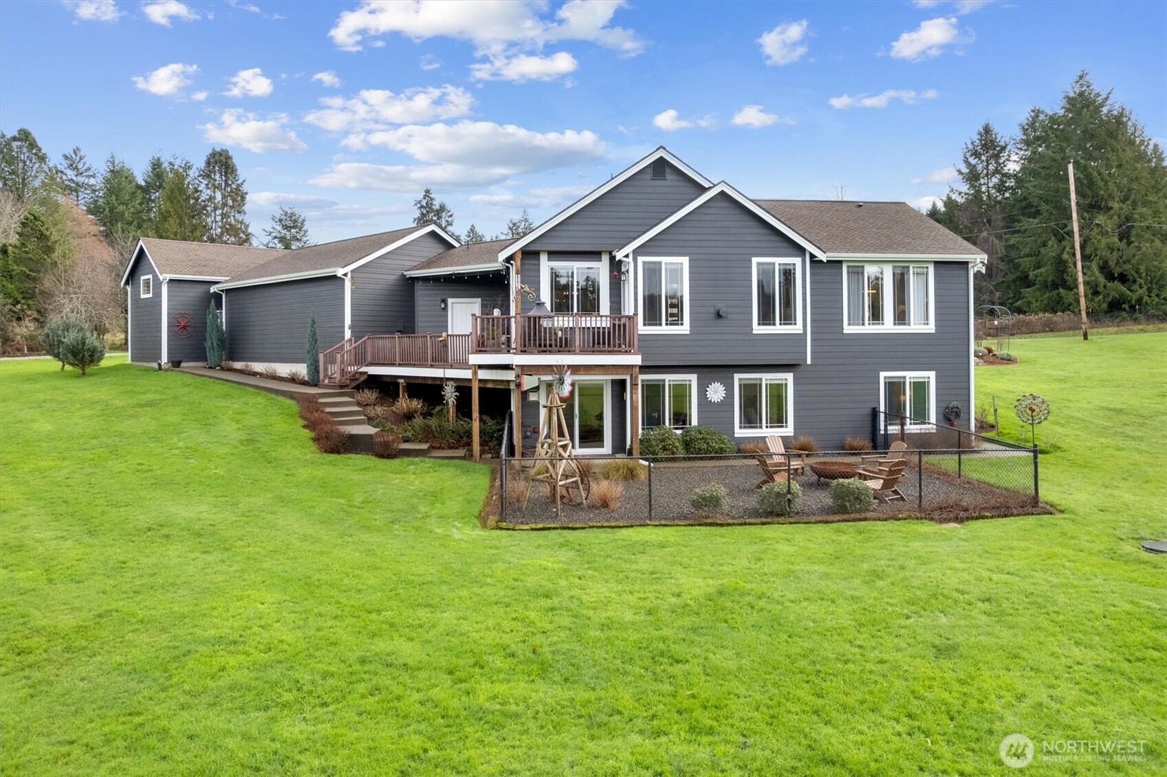 4946 Pleasant Glade Road Northeast Olympia, WA 98516 - Photo 28 of 38 a front view of a house with a garden and yard