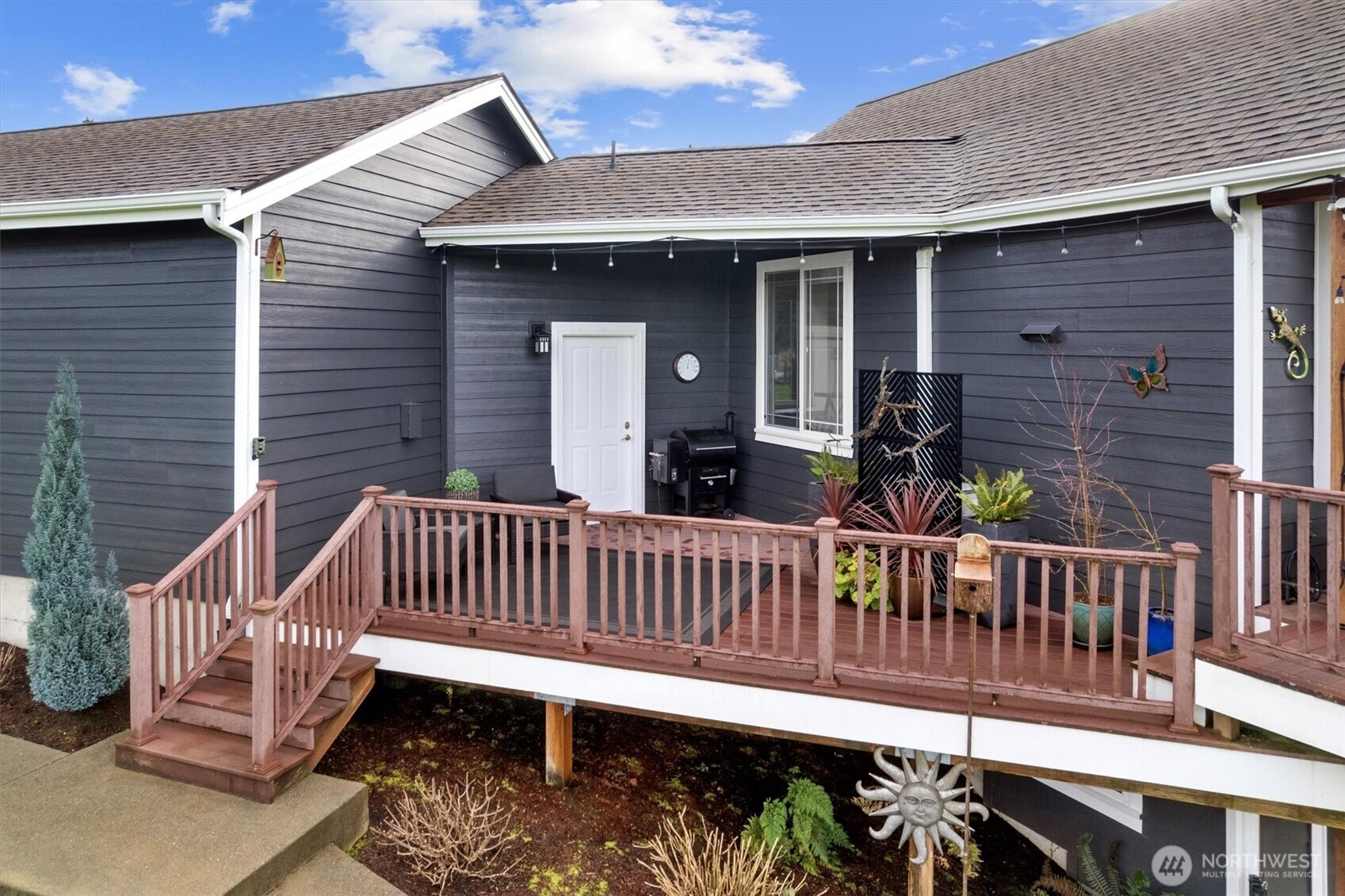 4946 Pleasant Glade Road Northeast Olympia, WA 98516 - Photo 29 of 38 a view of a deck with a table and chairs