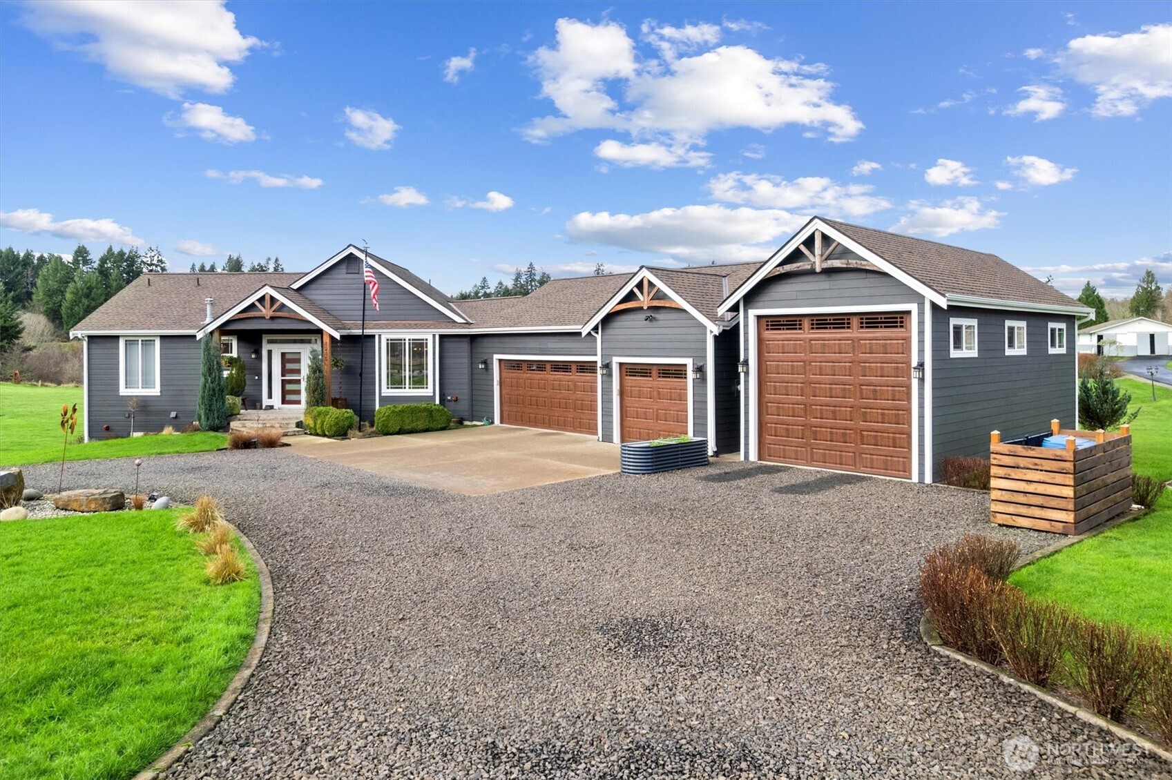 4946 Pleasant Glade Road Northeast Olympia, WA 98516 - Photo 4 of 38 a front view of a house with a garden