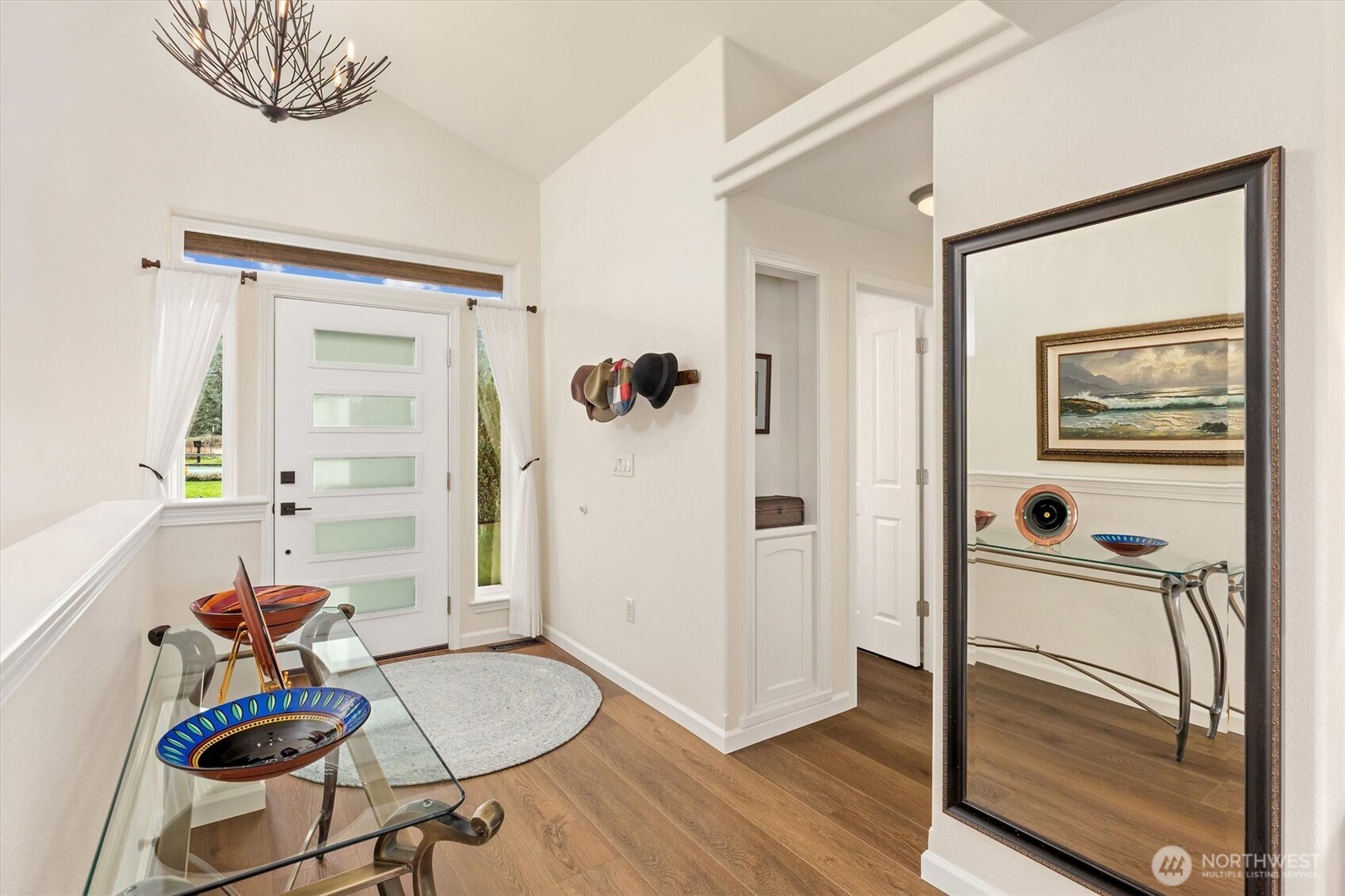 4946 Pleasant Glade Road Northeast Olympia, WA 98516 - Photo 5 of 38 a view of a livingroom with furniture and hardwood floor