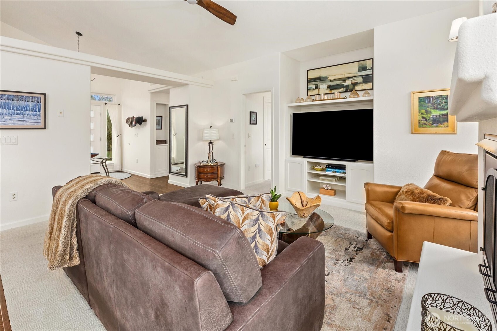 4946 Pleasant Glade Road Northeast Olympia, WA 98516 - Photo 8 of 38 a living room with furniture and a flat screen tv