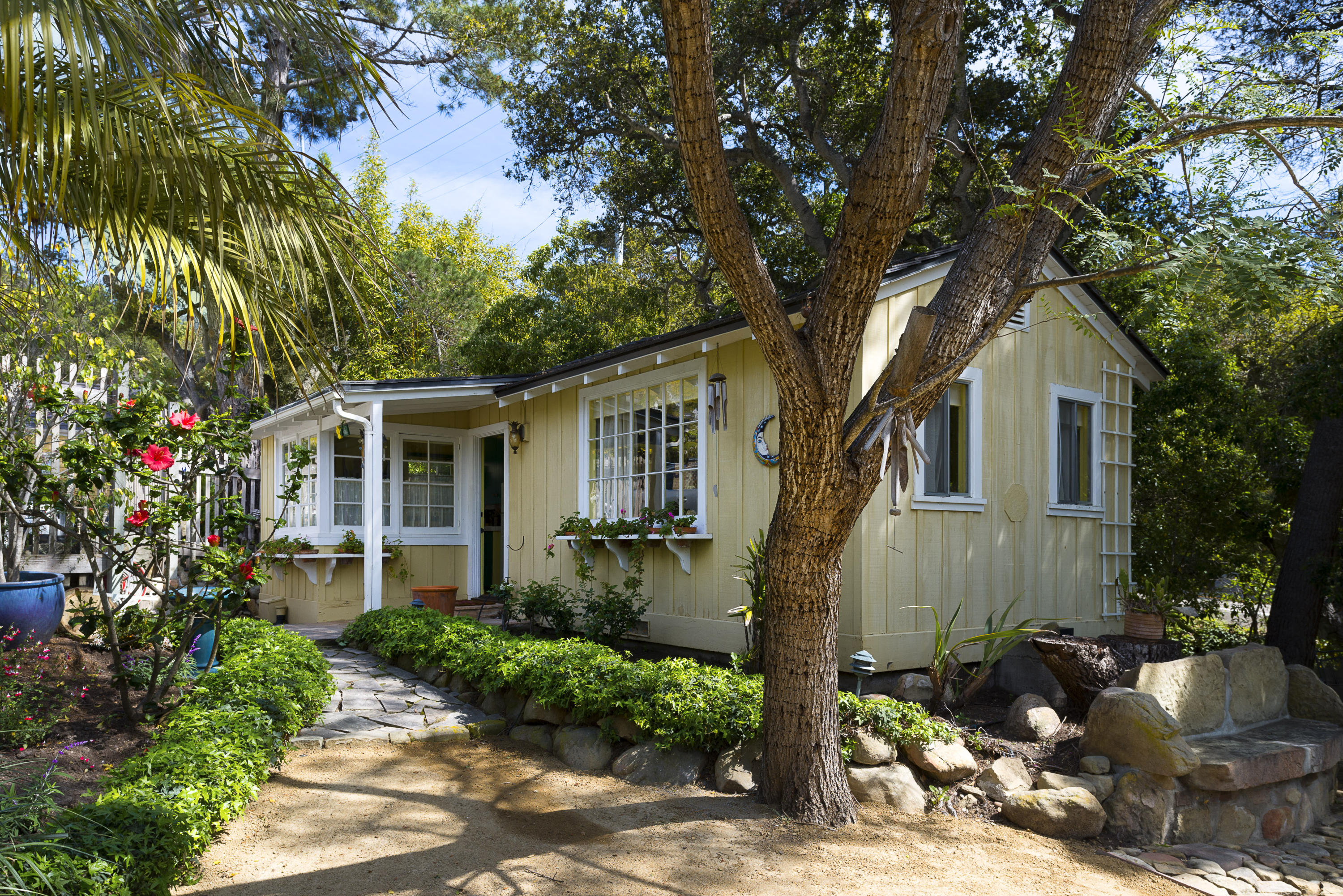 495 Toro Canyon Road Santa Barbara, CA 93108 - Photo 12 of 17 a front view of a house with garden