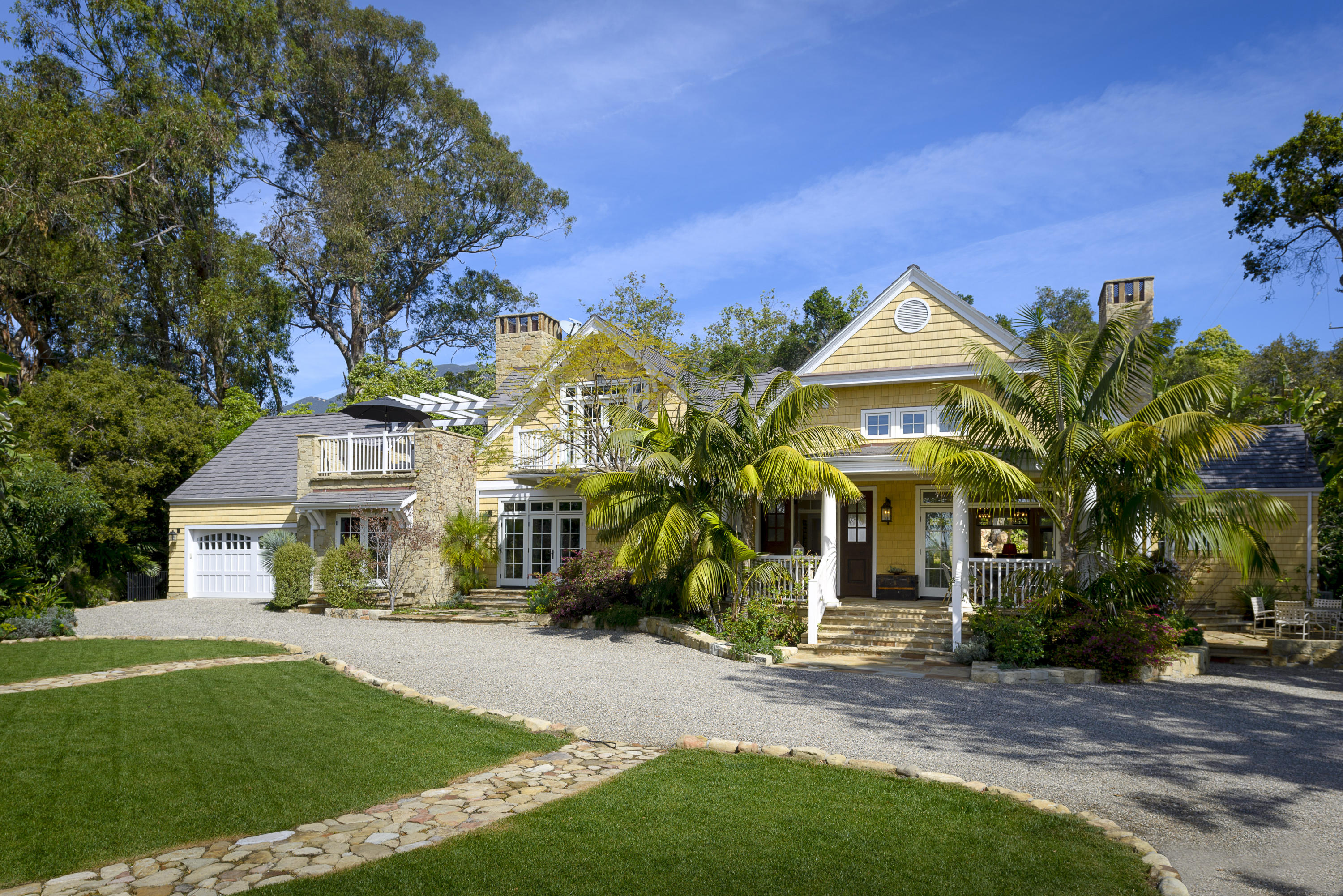 495 Toro Canyon Road Santa Barbara, CA 93108 - Photo 2 of 17 a front view of a house with a yard