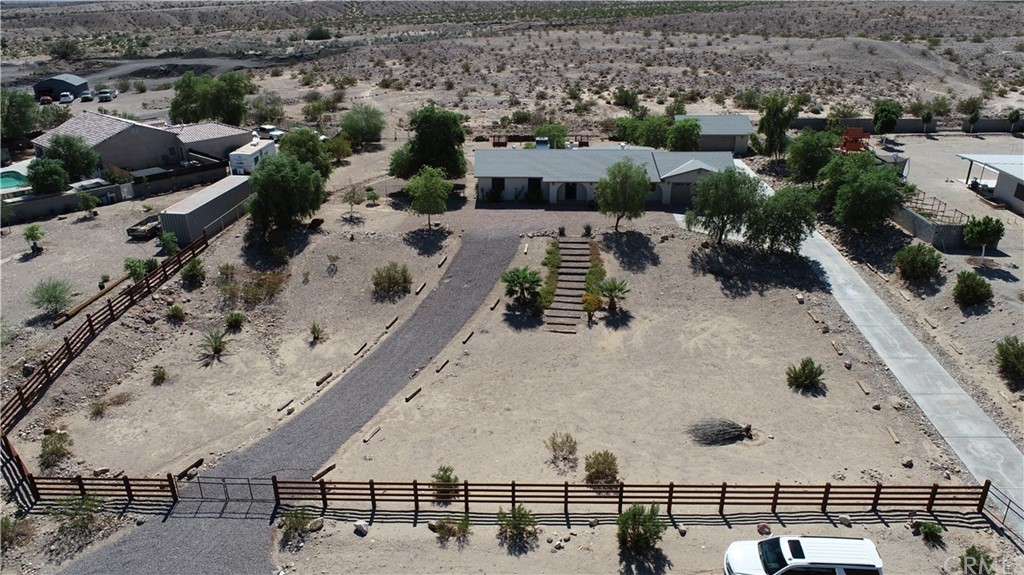205 Schulz Road Needles, CA 92363 - Photo 1 of 1 a view of a house with a yard and potted plants
