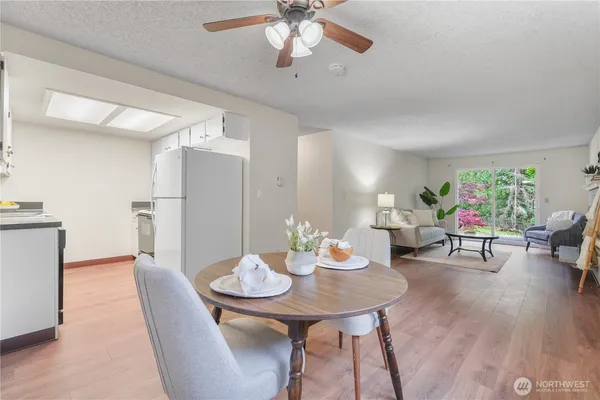 a view of a dining room with furniture and wooden floor