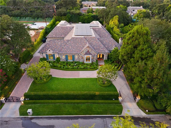 a swimming pool with outdoor seating yard and green space
