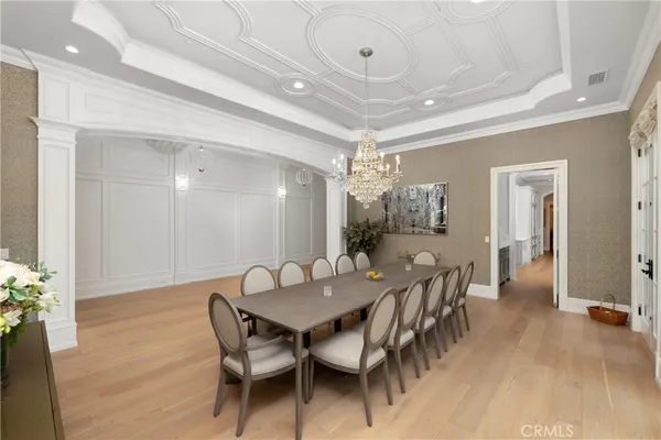a kitchen with granite countertop white cabinets and stainless steel appliances
