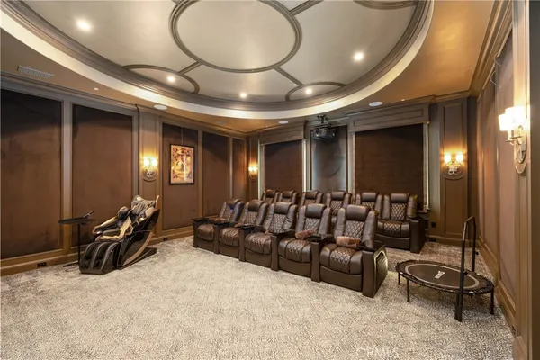 a living room with fireplace furniture and a chandelier