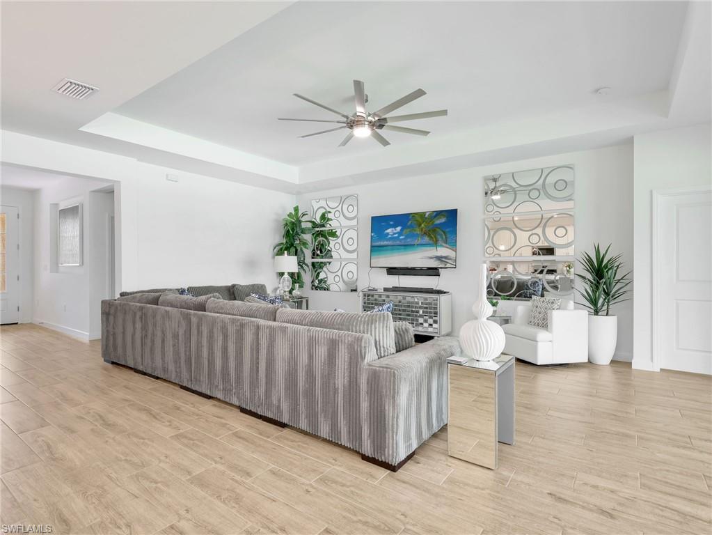 18278 Ridgeline Drive Estero, FL 33928 - Photo 13 of 45 a living room with furniture and a potted plant