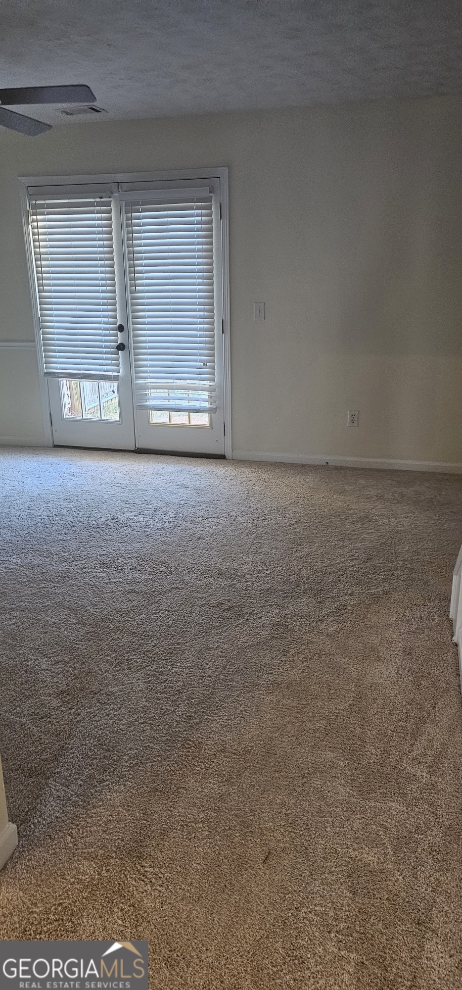 5000 Village Run Drive McDonough, GA 30252 - Photo 5 of 7 a view of an empty room with a window