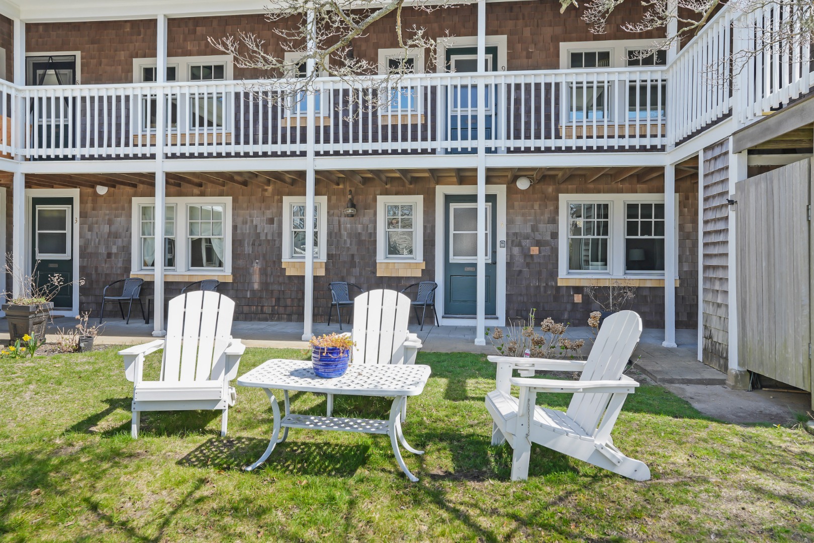 20 Peases Point Way North, Unit 4 Edgartown, MA 02539 - Photo 10 of 11 a view of a chair and table in the patio