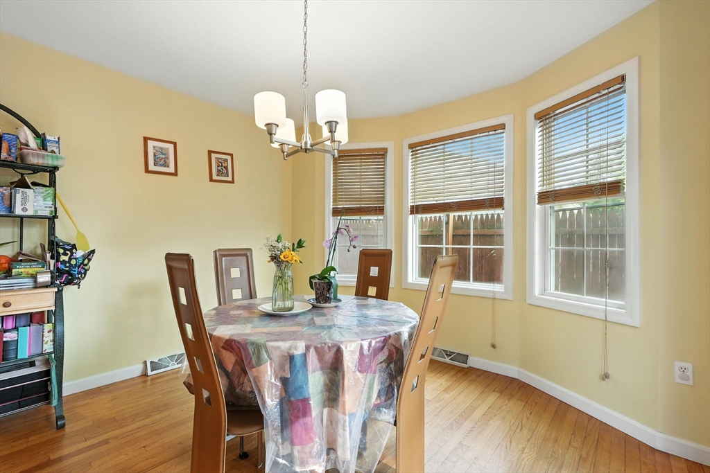 82 Lloyd Avenue Springfield, MA 01119 - Photo 12 of 32 a view of a dining room with furniture window and wooden floor