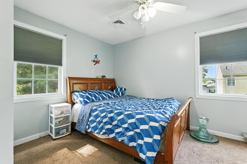 82 Lloyd Avenue Springfield, MA 01119 - Photo 18 of 32 a bedroom with a bed and a window