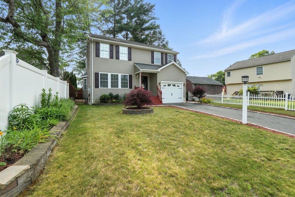 82 Lloyd Avenue Springfield, MA 01119 - Photo 2 of 32 a front view of a house with garden