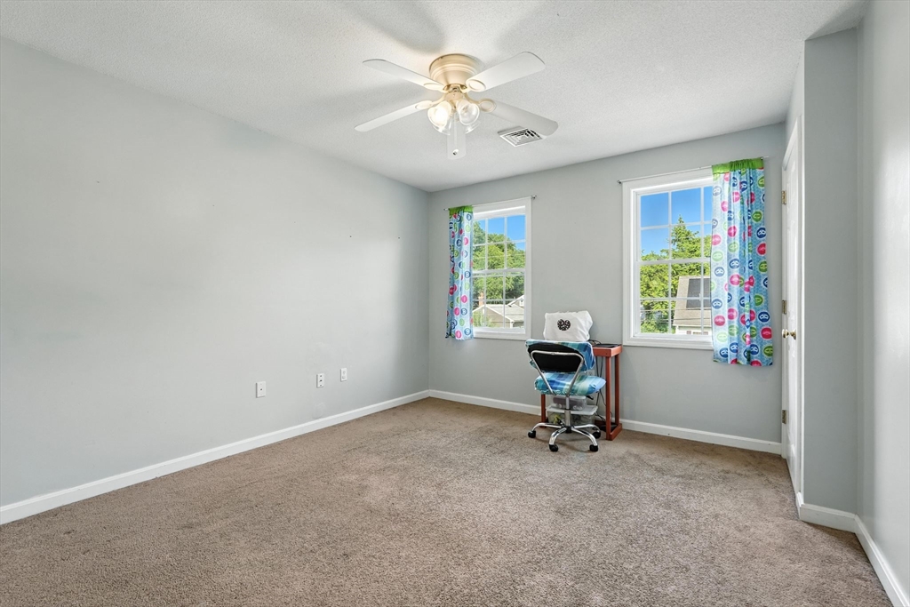 82 Lloyd Avenue Springfield, MA 01119 - Photo 21 of 32 a view of a workspace with furniture and a window
