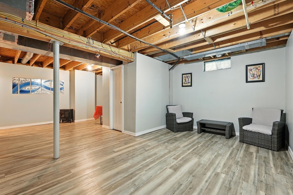 82 Lloyd Avenue Springfield, MA 01119 - Photo 24 of 32 a view of a room with wooden floor and furniture