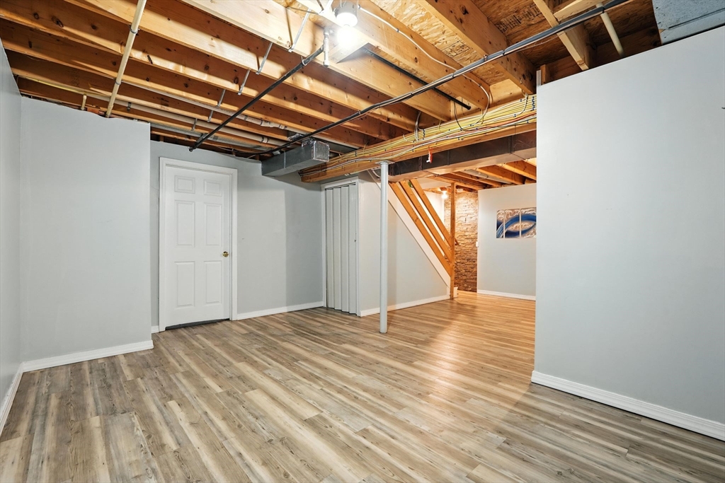 82 Lloyd Avenue Springfield, MA 01119 - Photo 25 of 32 a view of empty room with wooden floor