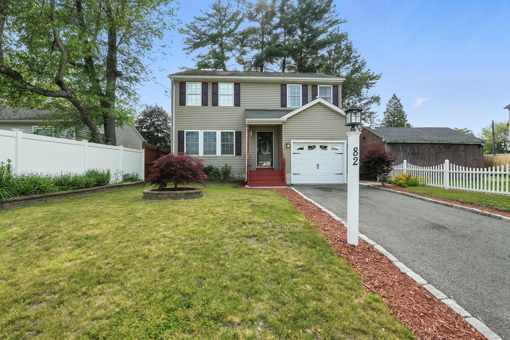 82 Lloyd Avenue Springfield, MA 01119 - Photo 4 of 32 a front view of a house with garden