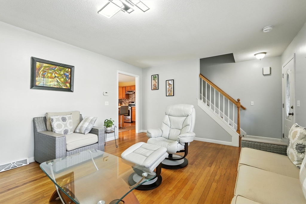 82 Lloyd Avenue Springfield, MA 01119 - Photo 5 of 32 a living room with furniture and wooden floor