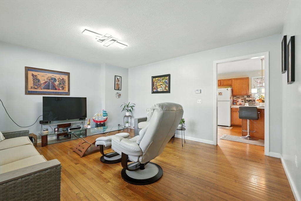 82 Lloyd Avenue Springfield, MA 01119 - Photo 6 of 32 a view of a livingroom with workspace and a couch