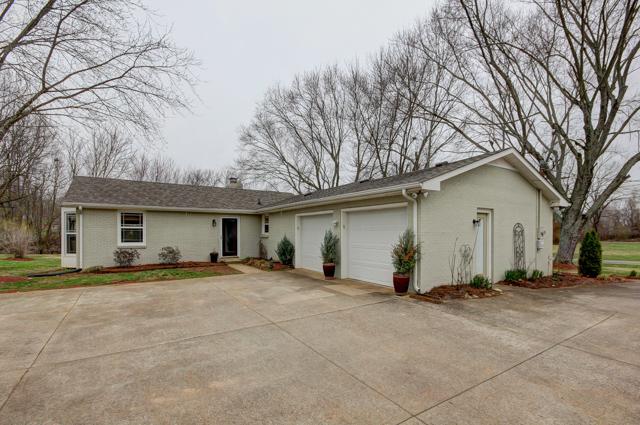 403 Sango Road Clarksville, TN 37043 - Photo 2 of 20 Large carport area with basketball goal to the rear. Game on!