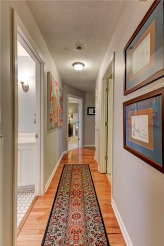 403 Sango Road Clarksville, TN 37043 - Photo 11 of 20 Hallway to bedrooms with more hardwood floors.