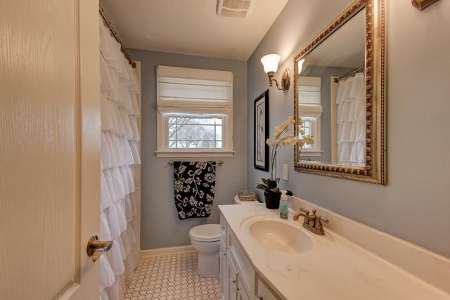 403 Sango Road Clarksville, TN 37043 - Photo 15 of 20 Full bathroom in hallway has been remodeled with new lighting, paint, hardware, and mirror.