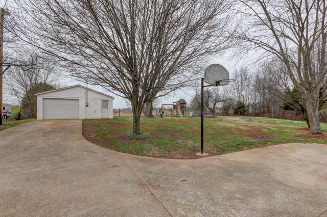 403 Sango Road Clarksville, TN 37043 - Photo 18 of 20 Detached shop is wired for heavy machinery and has plenty of storage!