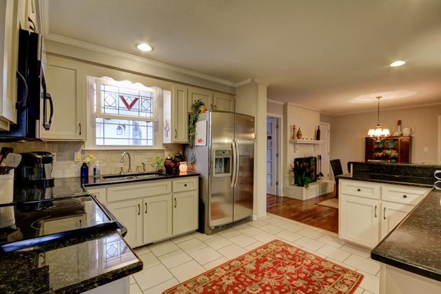403 Sango Road Clarksville, TN 37043 - Photo 7 of 20 Another view of this bright and spacious kitchen, with window overlooking back yard. Refrigerator and all appliances remain with the home.