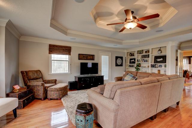 403 Sango Road Clarksville, TN 37043 - Photo 10 of 20 Another view of the living room with built-in book shelves and door to back deck.